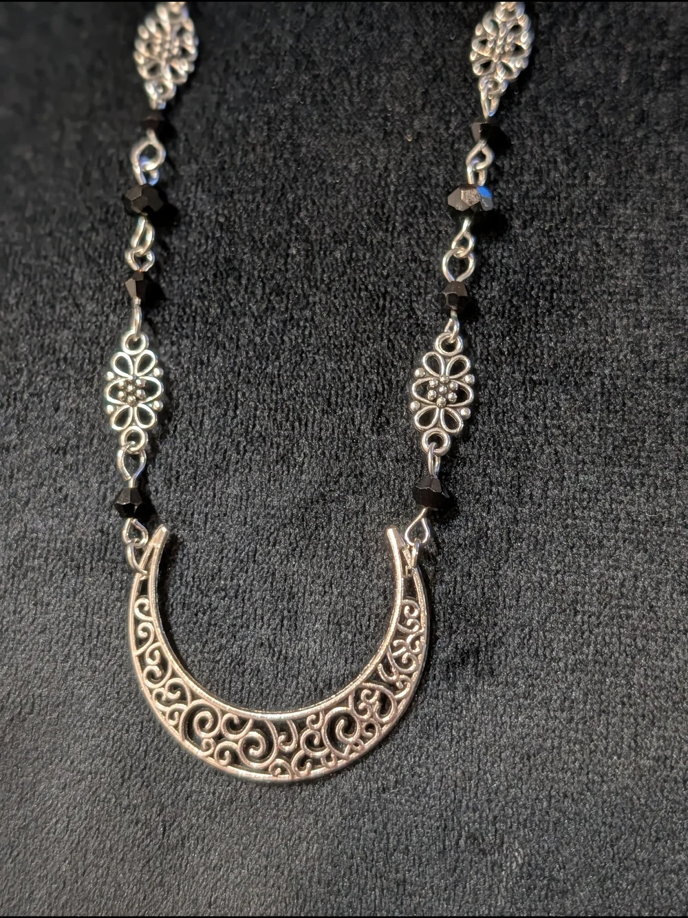 Silver Tone Filigree Crescent Pendant Necklace with Black Accents